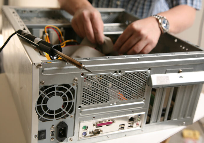 Computer repair fixing a computer