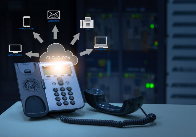 IP Telephony cloud pbx concept, telephone device with illustration icon of voip services and networking data center on background